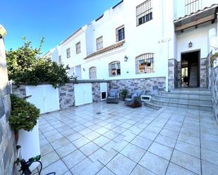 Exterior view of Single-family semi-detached for sale in Punta Umbría  with Terrace, Swimming Pool and Balcony