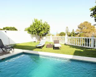 Jardí de Casa adosada de lloguer en Benalmádena amb Aire condicionat, Terrassa i Piscina